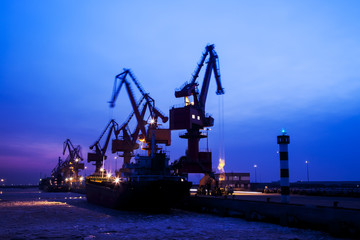 Fototapeta premium In the evening, portal crane in freight terminal