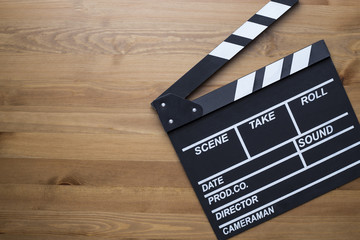 movie clapper on wood table