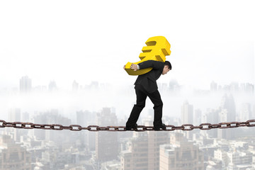 Man carrying golden euro sign balancing on chain