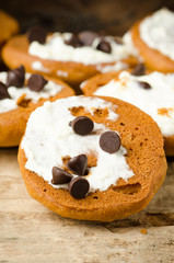 Homemade cookies with whipping cream and chocolate chip on top