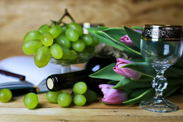 wine bottle book and glass grape