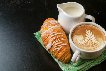 coffee with milk and croissant