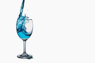 Cocktail  splash into wine glass isolated on white background.