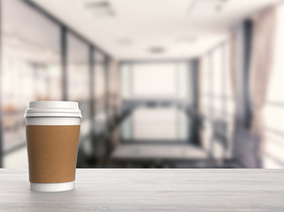 blank paper coffee cup with office background