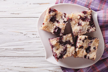 Berry pie with blueberries close-up on a plate. horizontal top view
