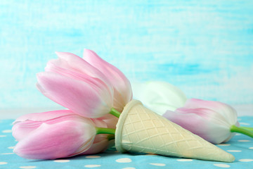 tulips pink and white in a waffle cone on the background fabric polka dot