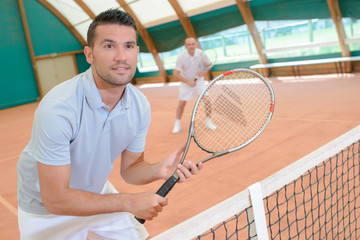 men in the tennis court