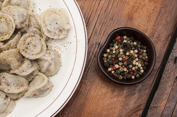 Homemade meat dumplings - russian pelmeni on plate