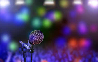 Microphone on stage against a background of auditorium