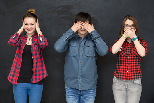 Young People making three wise monkey sign