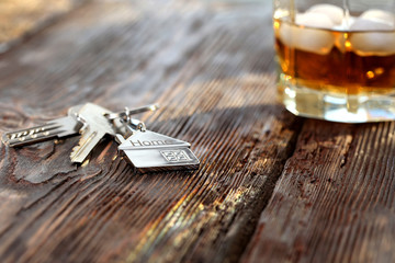 Keychain figure of house with keys and alcoholic drink