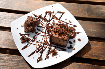 Chocolate cake with chocolate ice cream,