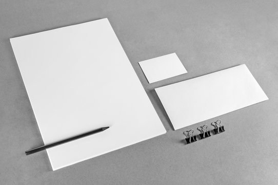 Blank stationery template on gray background. Photo of blank stationery set. Mock-up for branding identity. For design presentations and portfolios. Grayscale image.