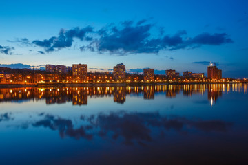 Night city reflection on the river in Donetsk. Ukraine