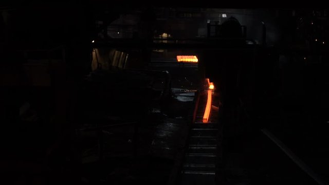 Sparks from the cutting of the red-hot billet circular saw 6