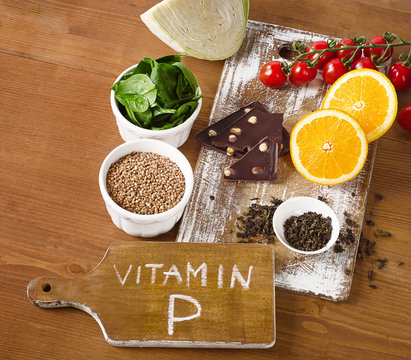 Foods high in vitamin P on  wooden table.