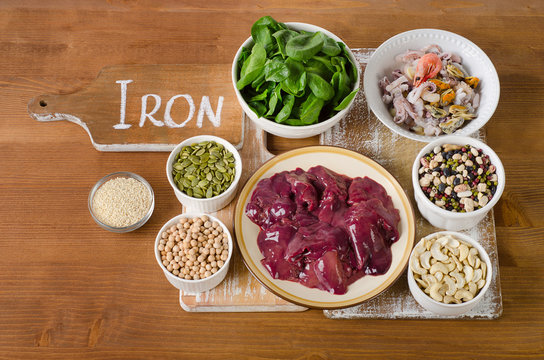 Foods high in Iron on wooden table.