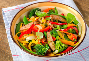 Beef stir fry with vegetables and herbs.