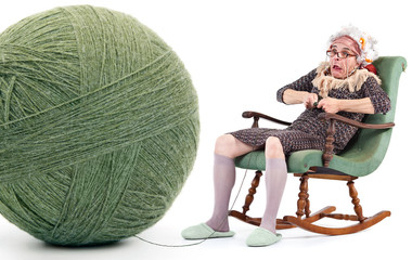 funny old lady knit with huge ball of yarn isolated on white