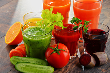 Glasses with fresh organic vegetable and fruit juices