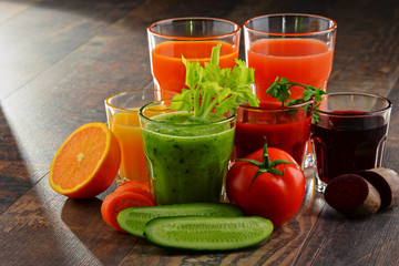 Glasses with fresh organic vegetable and fruit juices