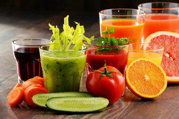 Glasses with fresh organic vegetable and fruit juices
