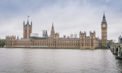 Fototapeta na wymiar River Thames and Palace of Westminster (known as Houses of Parliament). Palace of Westminster located on bank of River Thames in City of Westminster, London. UK.