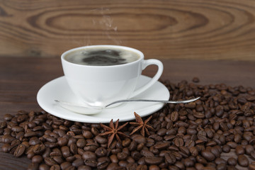 A cup of coffee and coffee beans