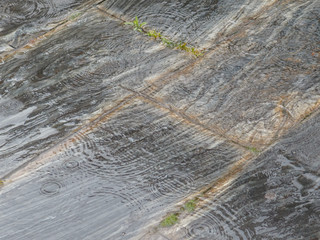 Slate floor wet by rain