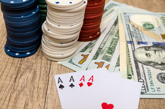 four aces  with chips and us dollar