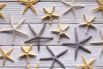 Fototapeta na wymiar Starfishes on wooden table