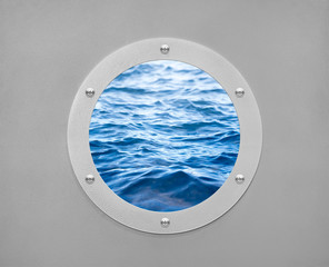 round porthole and sea wave