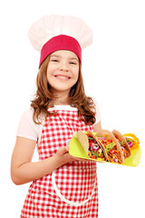 happy little girl cook with tacos fast food