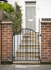 Welcome Home. An ornate wrought iron gate is a happy symbol of coming home. By opening the gate you...