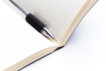 Pen and notebook close up