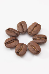 Coffee beans on the white table