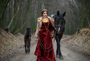 Princess on horseback in the woods
