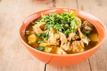 Jackfruit curry , Spicy foods on wooden floor.