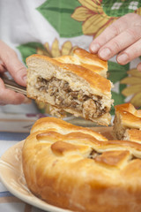 Cutting the tasty pie with filling
