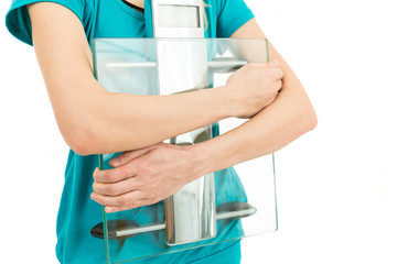 Diet woman holding scale