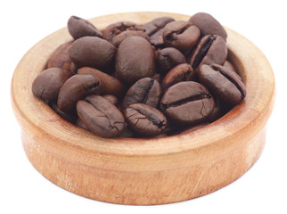 Roasted coffee bean in a wooden bowl