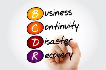 Fototapeta premium Hand writing BCDR - Business Continuity Disaster Recovery with marker, acronym business concept