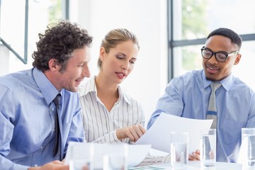 Business colleagues discussing a report