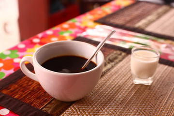 cup of black coffee with glass milk 