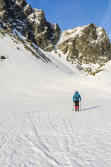 Hiker in winter conditions in the valley.