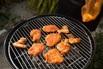 Spicy chicken wings on  BBQ grill