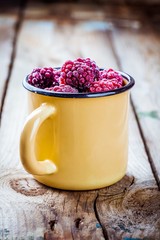 Frozen blackberries in a mug