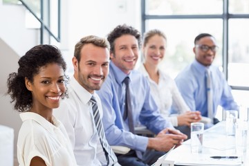 Businesspeople sitting together in meeting