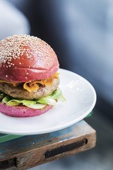 chicken burger with gherkins beetroot bread bun