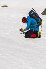 Father takes a picture of the little snowman.